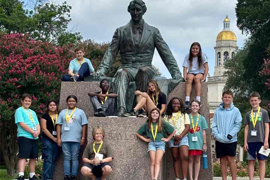 TIP Intermediate students with Judge Baylor statue