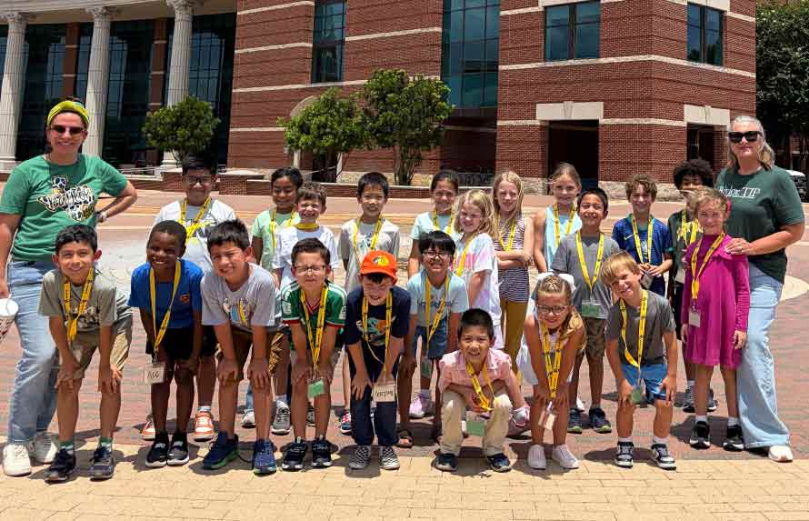 Group of UYP students with their teachers in front of the Baylor Science Building