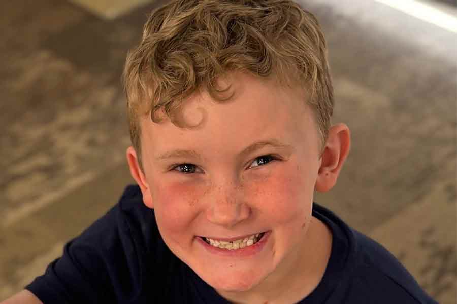 close up of young boy with red hair